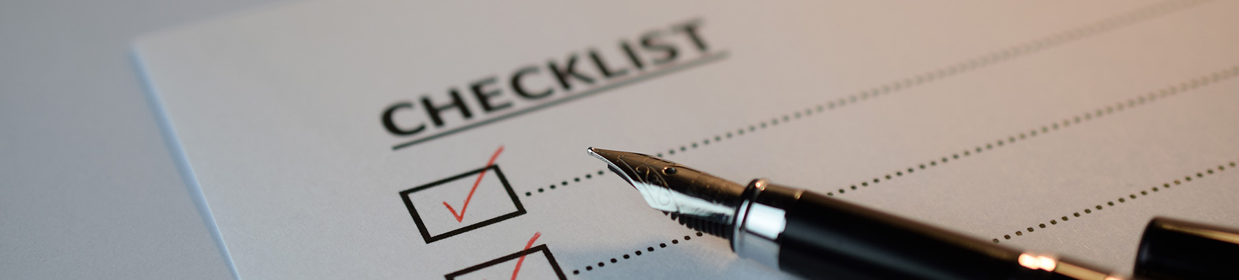Checklist - paper checklist with pen
