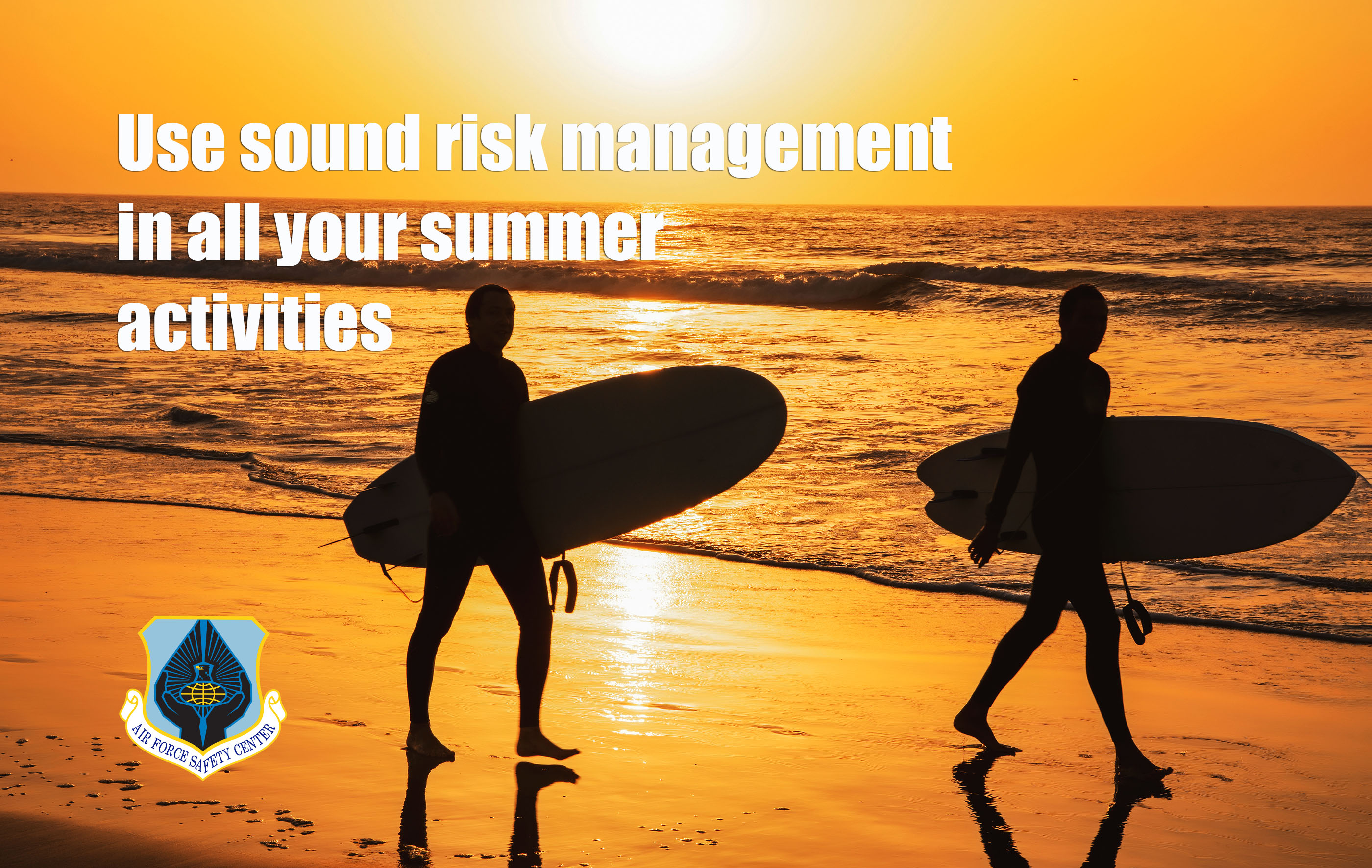 Air Force Safety Center Summer Message- Surfers walking on the beach with surf boards