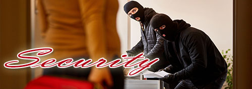 Security - two hooded men burglarizing a home