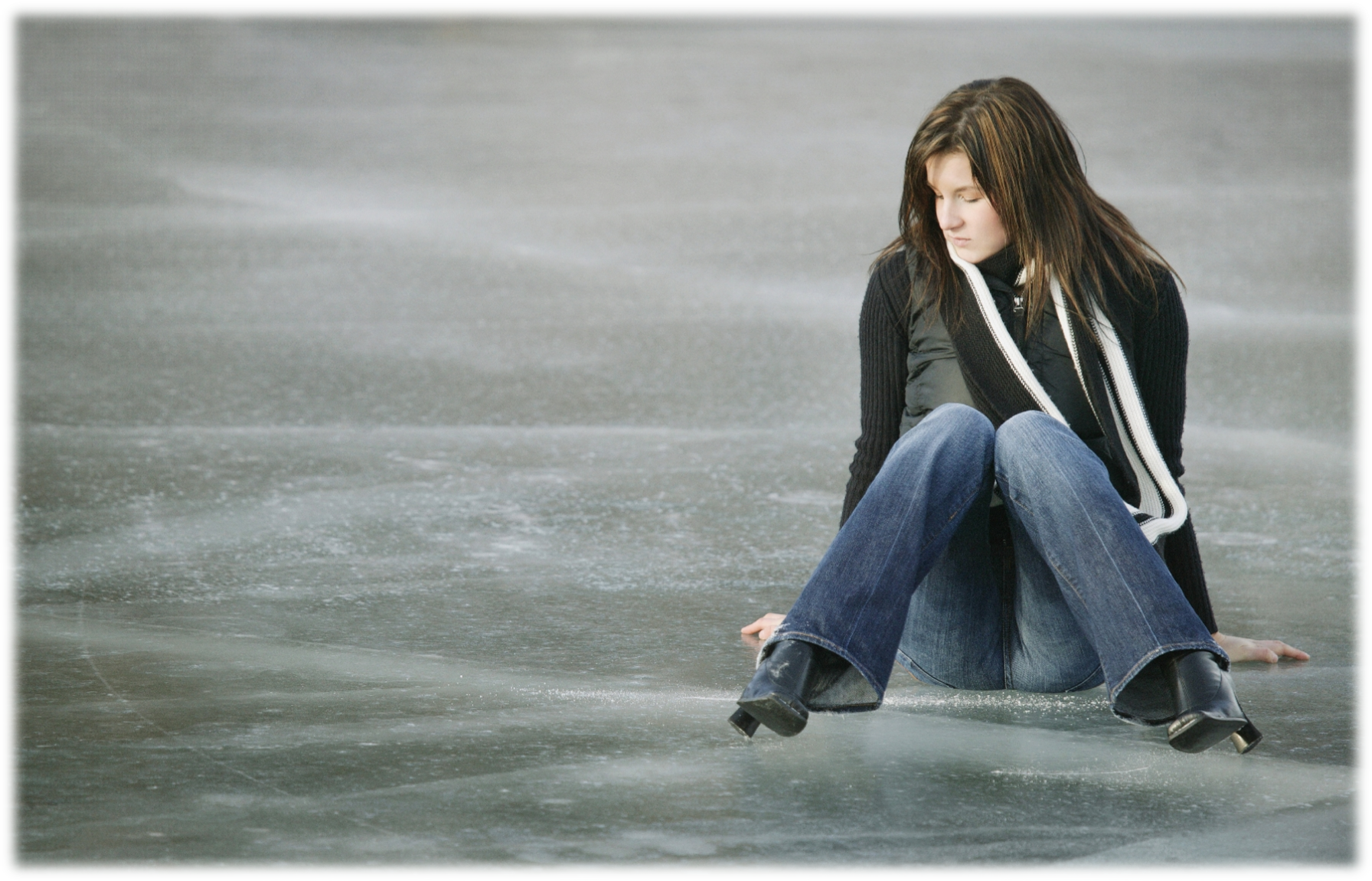 Link to Slips and Falls on ice page - female sitting on ice